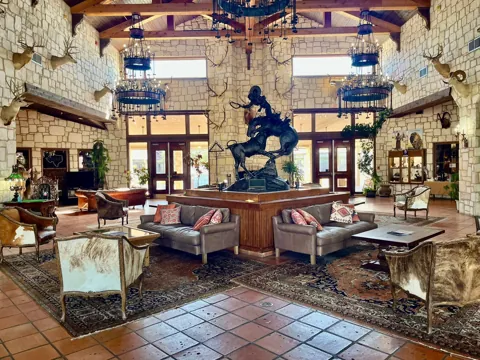 A historic hotel seating area with collected Western pieces