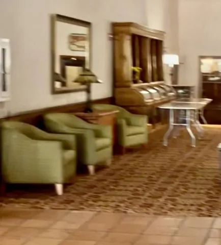 Chairs and tables arranged in a hotel interior