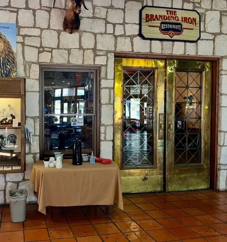 A doorway framed by stone walls and decorative pieces